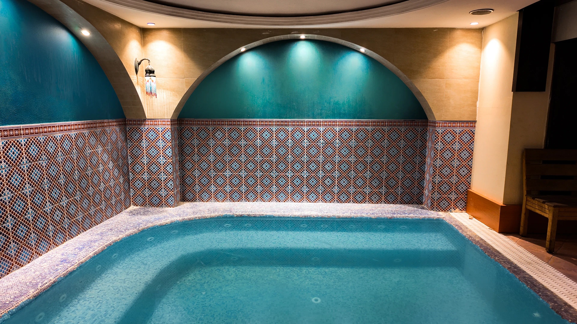 Jacuzzi area with mosaic tiles at Riga Palace Hotel